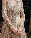 Close-up of a Beige Net bridal dress with crossed dupatta drape, a bridal dress brand from Pakistan