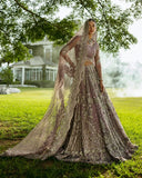 Woman wearing a Purple Net bridal lehenga choli with dabka and pearl embroidery, pakistani bridal wedding dress