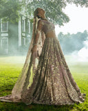 Woman in Purple Net lehenga choli with sequin embroidery, a bridal dress brand in Pakistan