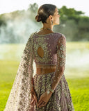 Woman in Purple Net lehenga choli, open-back embroidered blouse detail, a pakistani bridal dresses design