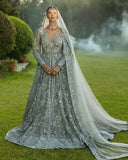 Woman wearing an Ice Blue Net bridal dress with dabka, pearl and crystal embroidery, a Pakistani designer bridal dress