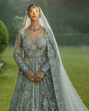 Woman wearing an Ice Blue Net bridal dress with pearl and crystal embroidered bodice, walima bridal dress