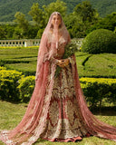 Woman wearing a Tea Pink Net bridal dress and veil, one of Mushq's pakistani wedding dresses