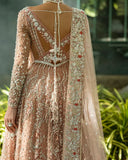 Close-up back view of peach embellished Net bridal lehenga with tasseled back detailing