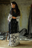Back view of a Black embroidered Net suit showing the floral hem detail