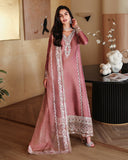 Woman wearing a dusty rose pink luxury pret suit with silver embroidery, Zarminay collection