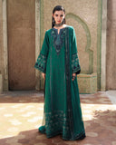 Woman wearing green embroidered raw silk suit with sequinned border and dupatta draped over shoulder
