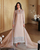 Woman wearing a beige luxury pret suit with silver embroidery, Zarminay collection