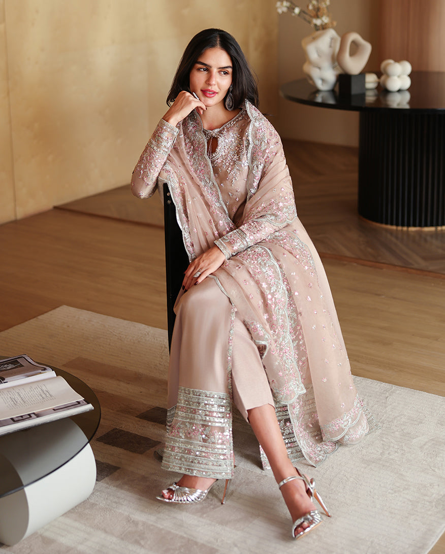 Seated styled shot of beige luxury pret suit with embroidered dupatta, Zarminay collection