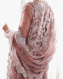 Close-up back view of mauve organza suit with dupatta draped over one shoulder