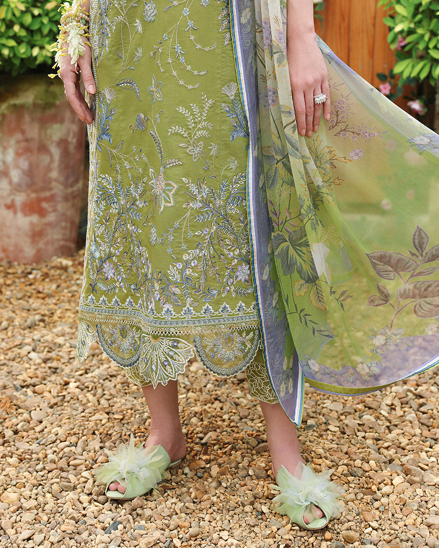 Close-up of scalloped lace hem on olive green unstitched lawn suit with embellished sandals, Secret Garden collection
