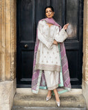 Woman wearing an Ivory resham-embroidered Raw Silk suit with a diagonal color-blocked dupatta