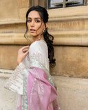 Close-up portrait in an Ivory Raw Silk suit with crystal and dabka embellished sleeve
