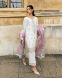 Woman wearing an Ivory Raw Silk suit with the sequinned dupatta draped over both shoulders