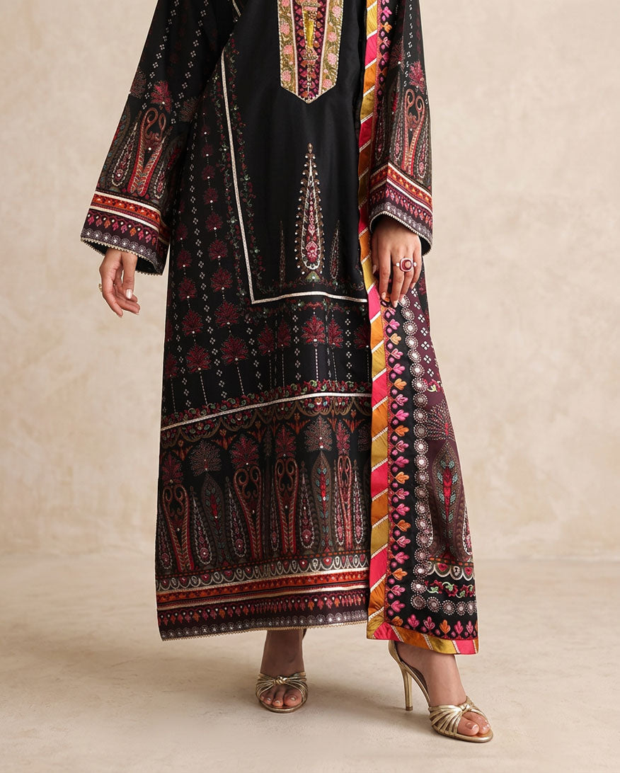 Close-up of embroidered hem border and striped dupatta on black printed raw silk suit