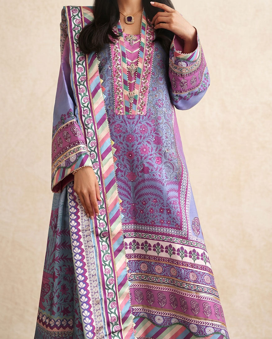 Close-up of hand embellished neckline buttons and embroidered silk lace on purple printed raw silk shirt