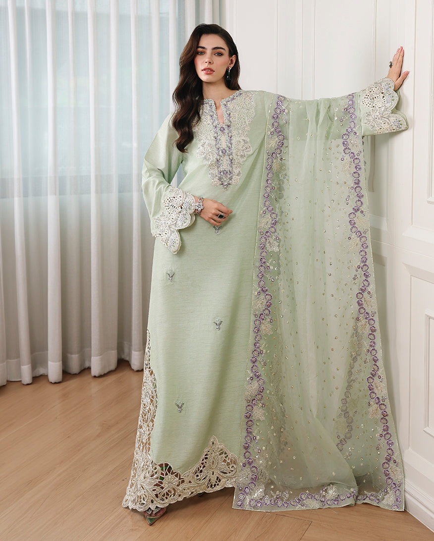 Woman wearing pista green Korean raw silk long shirt with embroidered neckline, cuffs, hem and organza dupatta