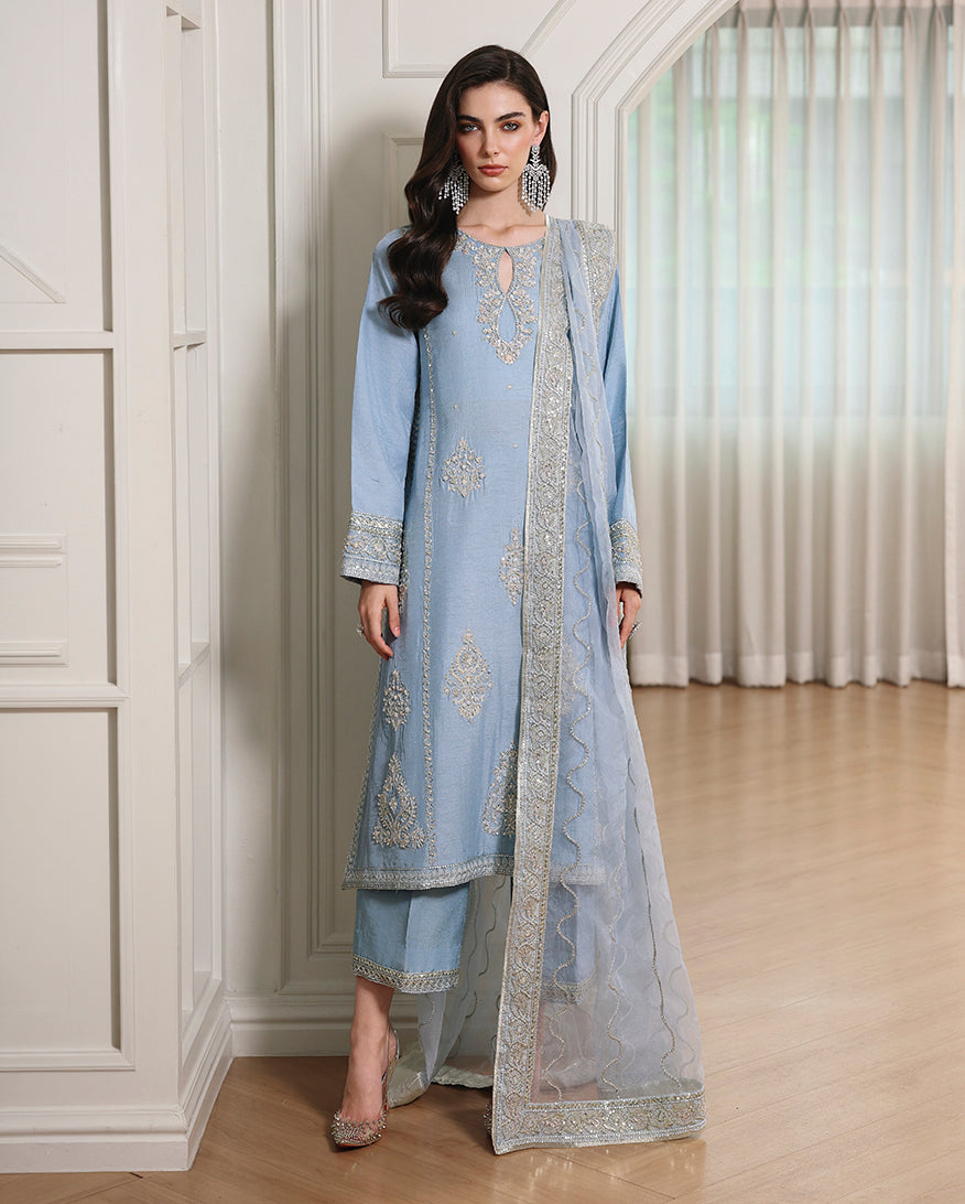 Woman wearing blue Korean raw silk full-length formal shirt with straight trouser and organza dupatta