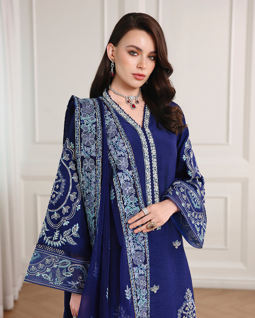 Close-up of embroidered neckline and sleeves on royal blue Korean raw silk shirt with organza dupatta
