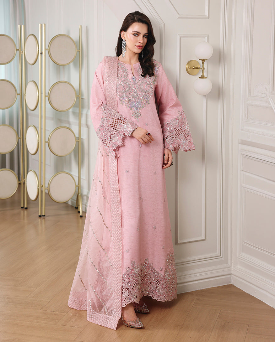 Woman wearing blush pink Korean raw silk long shirt with embroidered sleeves, hem and organza dupatta