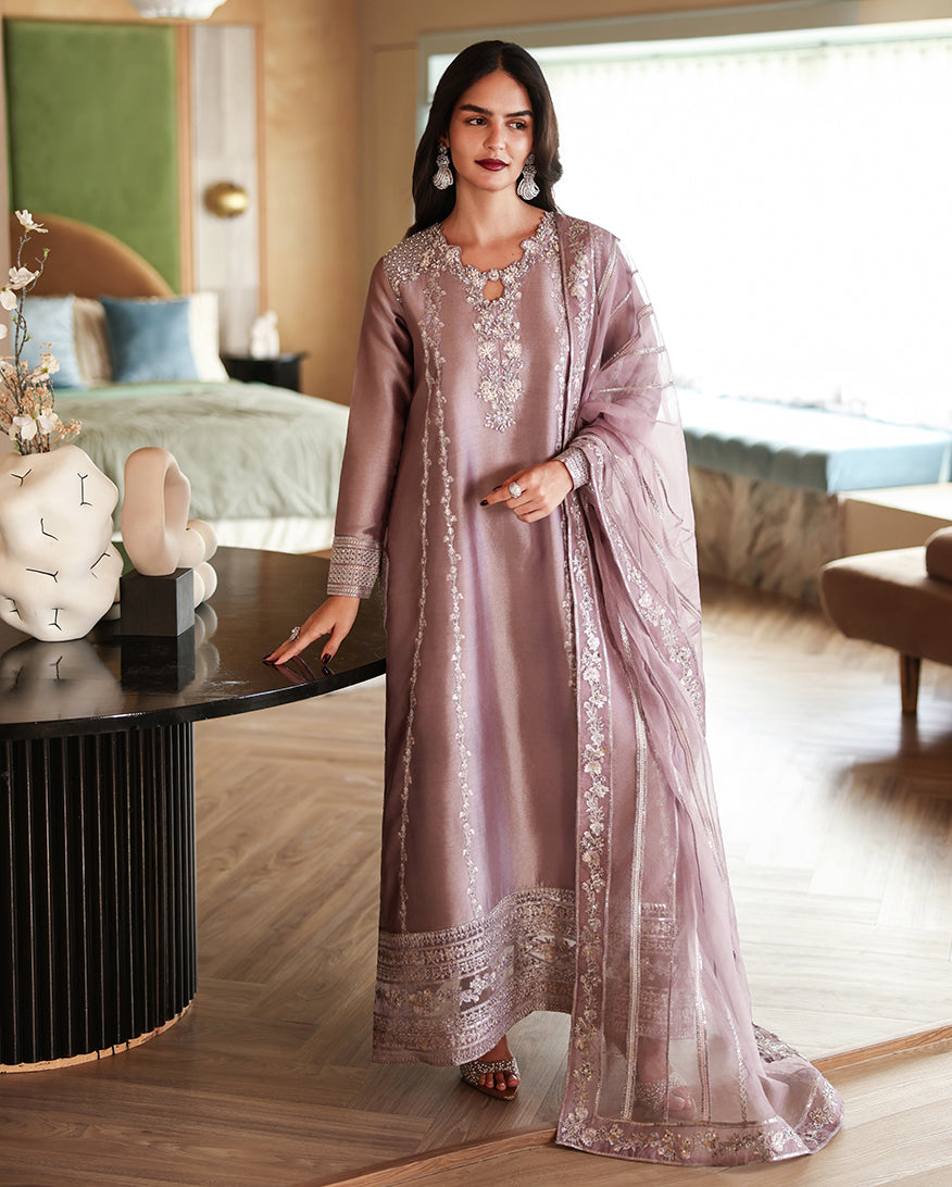 Woman wearing a dusty mauve luxury pret suit with silver embroidery, Zarminay collection